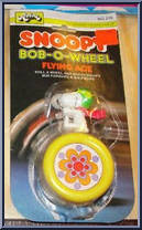 Snoopy (Yellow) from Peanuts - Bob-O-Wheels manufactured by Aviva [Front]